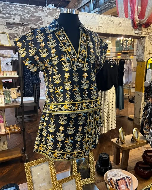 Patterned black and gold clothing styled on a mannequin at Work the Metal