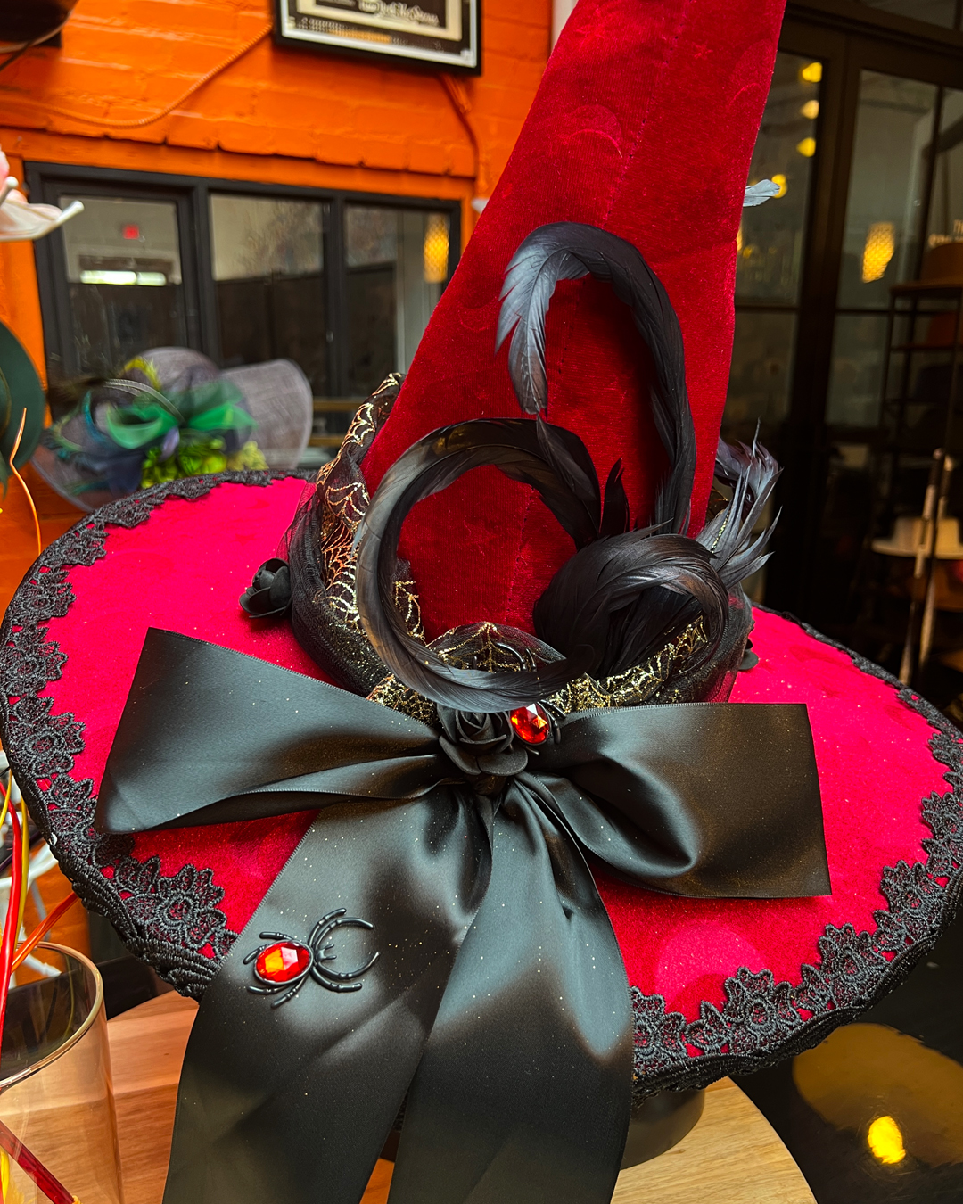 A red and pink embellished hat from The Hat Shoppe collaboration at Work the Metal