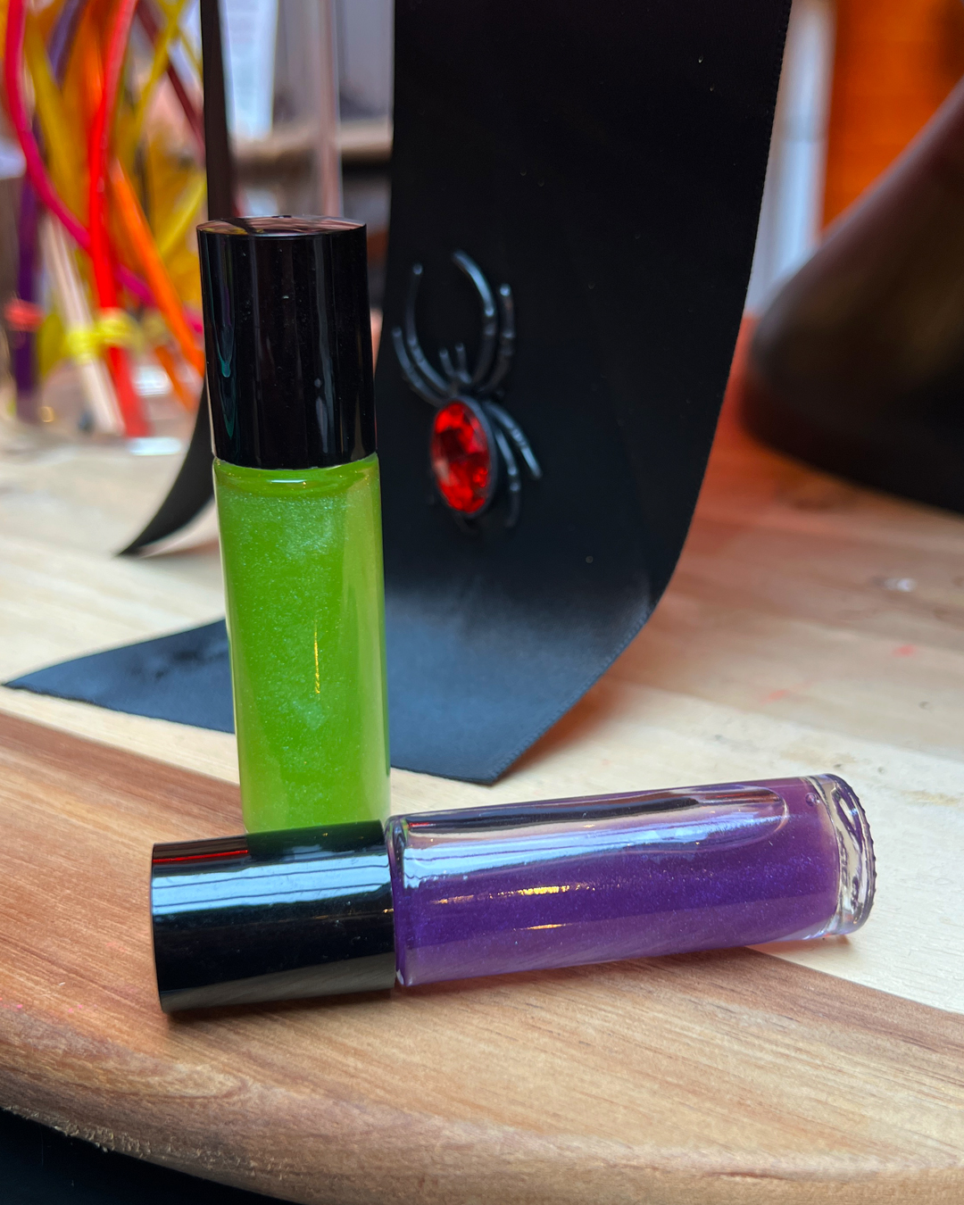 Green and purple roll-on perfumes from the Moss Hill collaboration at Work the Metal